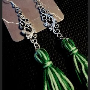 Green Tassel Earrings with Charm Embellishment